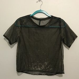 Goldish mesh t-shirt.